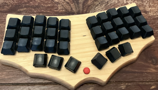 Finished MiniDox in wooden case, with TrackPoint between thumb keys