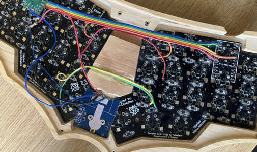 TrackPoint module mounted beneath the wooden case and connected to the Teensy